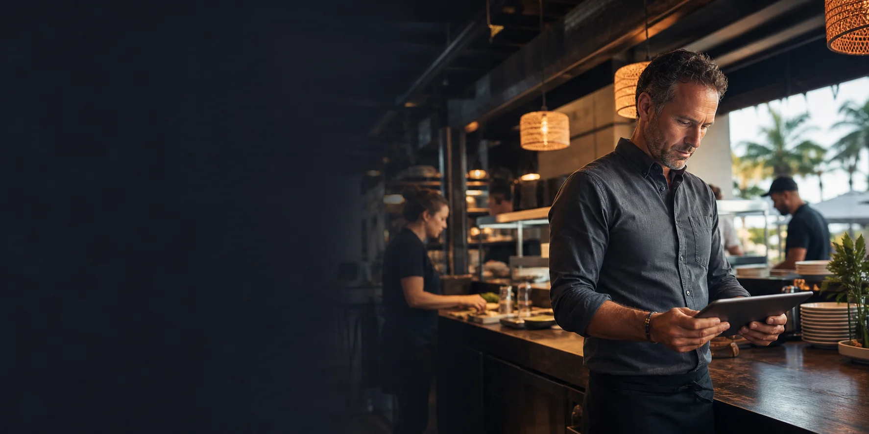 Restaurant owner reviewing technology and customer operations before service